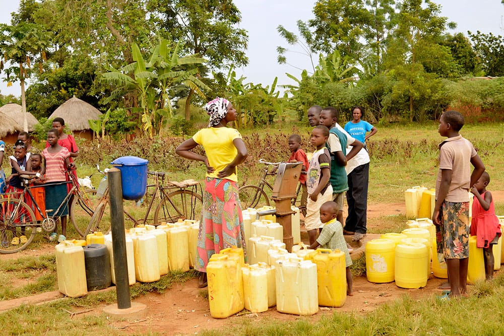 Community collecting water at borehole